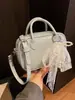 Bolsa de Bowling Feminina 2026 Estilo Novo de Primavera Simples e Fashionável Bolsa de Ombro de Nicho Popular de Alta Qualidade Bolsa Transversal