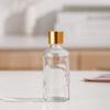 Venta al por mayor de fábrica botella de aceite de vidrio botella gotero con cabezal de arena botella de spray transparente botella de cosméticos portátil