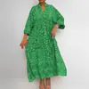 Moda femenina transfronteriza europea y americana 2026: elegante y casual, cuello mao, estampado, mangas acampanadas, tres cuartos de longitud, vestido largo de corte holgado