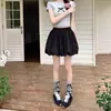 Shorts blancos de verano para mujer de cintura alta adelgazantes con pliegues de capullo de moda, negros, estilo europeo y americano