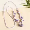 Collar con colgante de campana de mariposa de cerámica de estilo étnico retro para mujer, diseño nuevo y moderno, cadena larga para suéter, accesorios