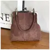 Bolso de mano de gamuza con diseño de nicho para comercio exterior para mujer, nuevo bolso retro con clip para teléfono, bolso de hombro cruzado versátil, moderno