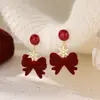 Brincos de floco de neve de laço de veludo vermelho feminino 2025 novas explosões leves brincos elegantes de luxo nicho sentido de ponta