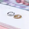Anillo de Nariz de Titanio Jiangtai F136 Anillo de Diamante Incrustado Cruzado de Doble Capa Joyería para Piercing Corporal de Aleación de Titanio G23 Pendientes