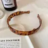 Nova popular faixa de cabeça dobrável estilo coreano, moderna e versátil, faixa de cabeça de alta qualidade com estampa de leopardo e cor vermelha sólida para mulheres