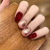 2026 Novo Estilo Pontas de Unha Cat-Eye Vermelhas Banhadas a Ouro Que Realçam a Pele, Estilo Curto, Sensação Elegante e de Alto Padrão, Arte de Unha Feita à Mão Adesivos de Unha Prontos