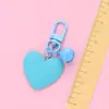 Nuevo llavero Bell love colgante lindo color resina corazón de durazno accesorios pequeño fresco adornos de corazón de durazno