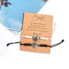Directo de fábrica nuevo pulsera tejida ajustable color mixto blanco y negro 2 baloncesto tarjeta de papel tejida serie de amantes