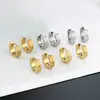 Pendientes de acero inoxidable de venta caliente transfronteriza personalidad de moda para hombres y mujeres mismos pendientes de acero de titanio color acero pendientes de oro de 18 quilates cierre de oreja