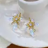 Brincos de Metal com Pétalas Incrustadas de Diamante, Design Simples, Transfronteiriços Europeus e Americanos, Femininos, Leves, Luxuosos, Doces e Versáteis, Atacado de Brincos