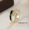 Anillo de diamante entrelazado de doble capa estilo ins europeo y americano con esmalte blanco y negro, anillo de circón de lujo ligero con un diseño único