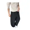 Calça de moletom retrô americana 2026 com cordão, solta e casual, design de retalhos, perna larga, estilo de perna curva, high-street, versátil e esportiva