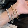 Europa y Estados Unidos pulsera de serpiente de circón transfronteriza diseño de nicho femenino chapado en 18k pulsera abierta de hueso de serpiente pulsera de moda venta al por mayor