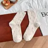 Calcetines holgados de otoño e invierno, amigables con la piel y cómodos, calcetines de media pantorrilla con estampado floral pequeño para mujer, calcetines largos versátiles estilo Ins, calcetines de algodón peinado para mujer
