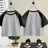 Camiseta de algodón puro para niños, manga corta, bloques de color 2026 verano, unisex, versátil, moderna, bloques de color, raglán, manga media, camiseta básica