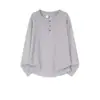 Camiseta de manga larga de color liso con cuello henley estilo americano para hombre, marca de tendencia nueva primavera y otoño 2026, top pullover holgado y versátil para mujer
