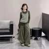 Conjunto de Ropa de Otoño para Niñas 2026 Nuevo de Moda Chal Rayado Falso Dos Piezas Top de Manga Larga y Pantalón con Falda Conjunto de Tres Piezas