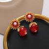 Pendientes estilo palacio francés para mujer, diseño de nicho de alta gama, pendientes de flor de perla, elegantes pendientes de metal.