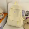 Nova mochila escolar de alta qualidade transfronteiriça para alunas do ensino médio, estilo universitário, cor sólida, grande capacidade, simples e versátil