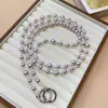 Elegante y estilosa cadena larga de perlas minimalista para teléfono, cadena cruzada para bolso de cámara, venta al por mayor para mujeres