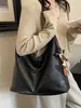 Bolso de Lona Retro de Gran Capacidad para Salir y Viajar 2026 Nuevo Elegante Casual Color Sólido Debajo del Brazo Diseño de Moda Bolso de Hombro