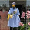 Roupas Femininas Transfronteiriças Europeias e Americanas Verão 2026 Novo Estilo Elegante e Fashionable Vestido Camisa Listrado Azul com Gola e Gravata para Mulheres