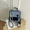 Mochila de Estilo Universitario de Nicho para Mujer Otoño 2026 Nuevo Bolso de Hombro Versátil con Bloques de Color para Viaje Bolso Cruzado Texturizado para el Trabajo
