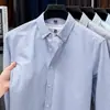 Camisa de Hombre 100% Algodón Puro Primavera y Otoño Nuevo Textil Oxford Lavado Rayas Verticales Top Casual Camisa de Manga Larga para Hombre