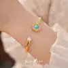 Pulsera abierta de perla redonda con circonita chapada en oro real de 18k, elegante estilo vintage, joyería de nicho de lujo ligero al por mayor