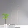 Tienda de ropa Nakajima, estante de exhibición de piso de acero inoxidable, estante de exhibición colgante plateado, tienda de ropa para hombres y mujeres, estante de exhibición de ropa colgante