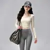 Conjunto deportivo de yoga de secado rápido para mujer, con un top de manga larga protector del sol y pantalones deportivos elásticos y transpirables, un atuendo versátil para el día a día