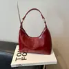 Bolso pequeño de piel aceitosa con textura de alta calidad para mujer, nuevo estilo 2025, bolso cruzado versátil y moderno, bolso tote pequeño súper popular para un solo hombro o debajo del brazo