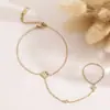 Elegante pulsera y anillo de trébol de cuatro hojas con diamantes estilo francés, exquisito accesorio de mano versátil y elegante para mujer