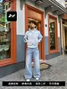 Jeans acampanados azules vintage para hombres y mujeres, estilo high street, lavados con efecto bigotes de gato, modernos, adelgazantes y casuales