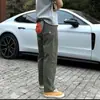 Nuevo modelo de comercio exterior de principios de otoño con pequeño logo de triángulo, pantalones de trabajo para exteriores estilo americano, pantalones casuales funcionales para hombre, pantalones largos versátiles de caparazón blando