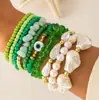 Conjunto de pulseiras de férias estilo boêmio transfronteiriço europeu e americano, pulseira multicamadas com sementes, concha e estrela-do-mar