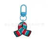 Llavero de Regalo de Navidad Más Vendido Hebilla en Forma de U de Macarrón Colgante de Goma Suave de PVC de Dibujos Animados Accesorios para Bolsas Colgante Pequeño