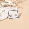 Aretes de cerámica de flor de cinco pétalos aretes frescos originales para estudiantes y chicas nuevo suministro para transmisiones en vivo en línea