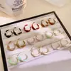 Pendientes de Tornillo Retorcidos Esmaltados con Goteo de Aceite Estilo Coreano Chapados en Oro Cobre para Mujer, Nuevos Pendientes de Botón de Moda Trendy de Lujo Ligero de Nicho con Temperamento