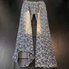 Jeans retro americano amarillo con estrella de cinco puntas en jacquard y dobladillo curvo para hombre, estilo de alta costura, corte recto, adelgazantes, pantalones ligeramente acampanados