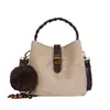 Bolso de mano nuevo de comercio exterior transfronterizo, bolso tipo cubo moderno y elegante para mujer, con un diseño único, adecuado para el trabajo diario, y se puede llevar como bolso de hombro o bolso cruzado