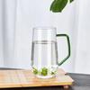 Taza de té de vidrio transparente con asa de color simple para el hogar, taza de té verde de vidrio de borosilicato, taza para beber, disponible en fábrica
