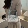 Bolso de mano estampado de nicho súper popular para mujer, nuevo modelo 2026, mini bolso cruzado versátil, bolso tote pequeño para salir