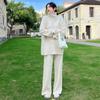 Traje de moda de estilo perezoso para mujer, otoño e invierno, nuevo suéter de cuello alto de manga larga de punto, pantalones casuales de pierna ancha que combinan con todo, conjunto de dos piezas