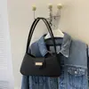 Bolso de axila de nicho estilo francés 2026 nuevo modelo bolso de mano simple bolso de hombro de moda bolso cruzado bolso pequeño para mujer