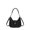 La popular bolsa de hombro dulce tipo bollo de este año para mujer, nuevo estilo Otoño 2026, textura de color liso, bolso de un solo hombro, para ir al trabajo, bolso cruzado