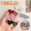 Botón con forma de corazón para ceñir la cintura, una herramienta mágica para ajustar el tamaño de la cintura de faldas y pantalones, un botón decorativo para apretar y fijar