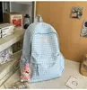 2026 Nova Mochila Xadrez Grande Capacidade Casual Estilo Coreano Estilo Acadêmico Ensino Fundamental Médio Sala de Aula Mochila Escolar Mochila Feminina