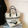 Bolso de Lona Lavada con Letra Bordada de Gama Alta 2025 Nueva Textura Casual Otoño e Invierno Retro Bolso Tote Cruzado