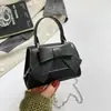 Elegante y moderna bolsa de nicho con lazo para mujer, nueva moda, bolso cruzado versátil, bolso de mano de color liso para salir